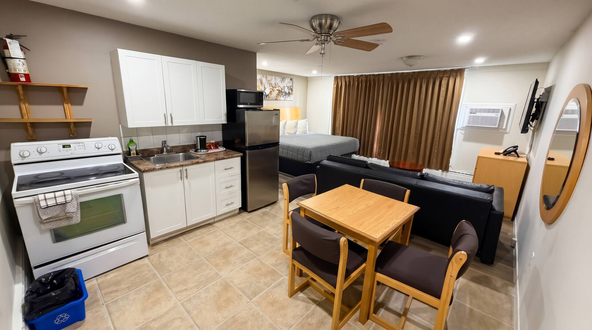 One King Bed, Sofa Bed & Kitchen at Perth Plaza Rooms & Suites