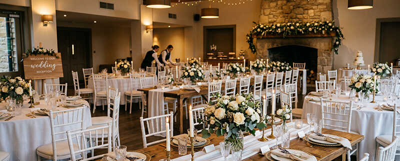 Dining hall set up for a wedding celebration